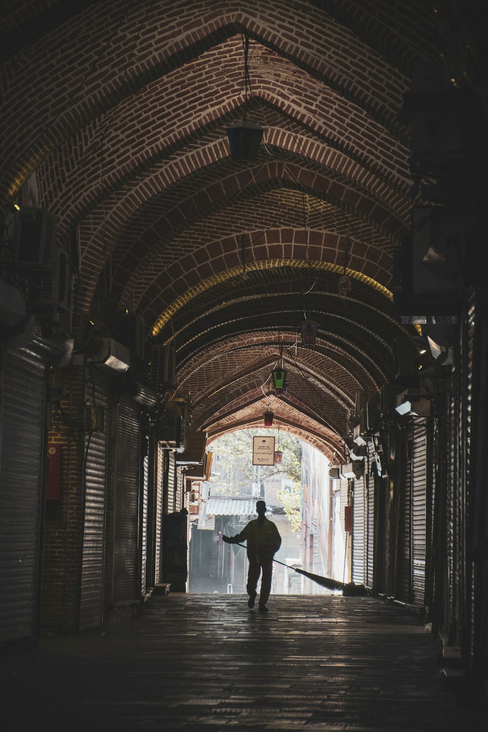 a person walking through a tunnel