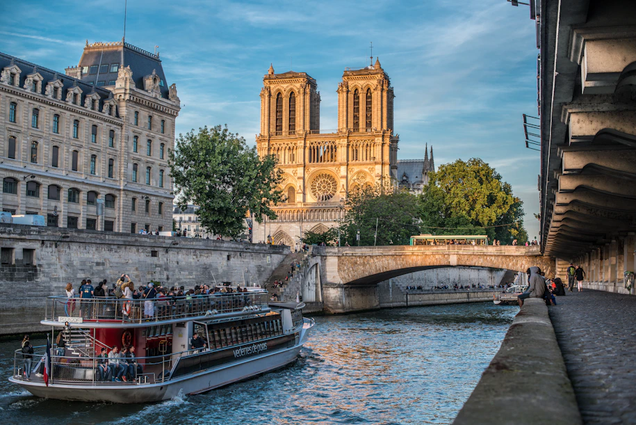 a boat on a river with buildings on either side of it