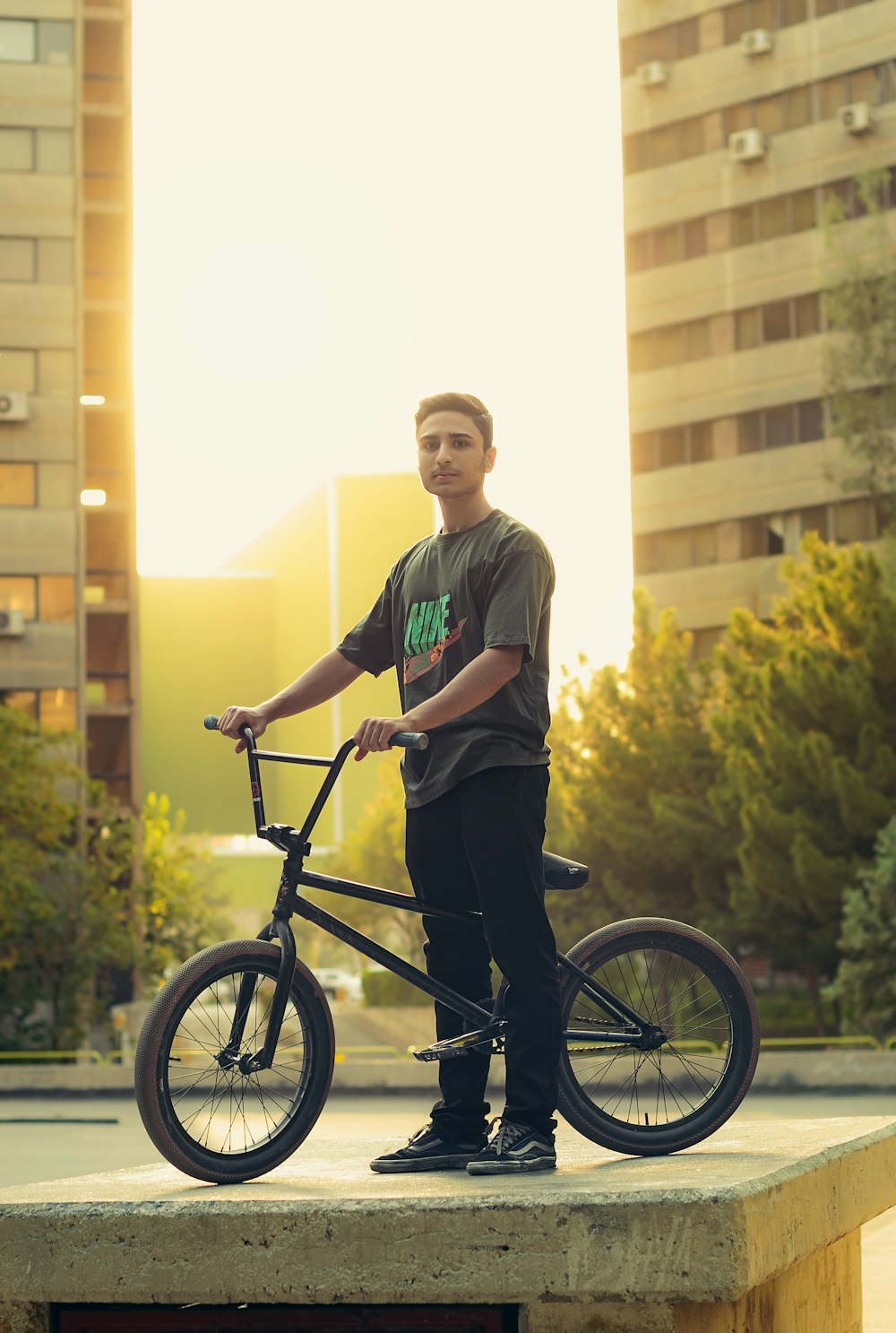 a man standing next to a bicycle