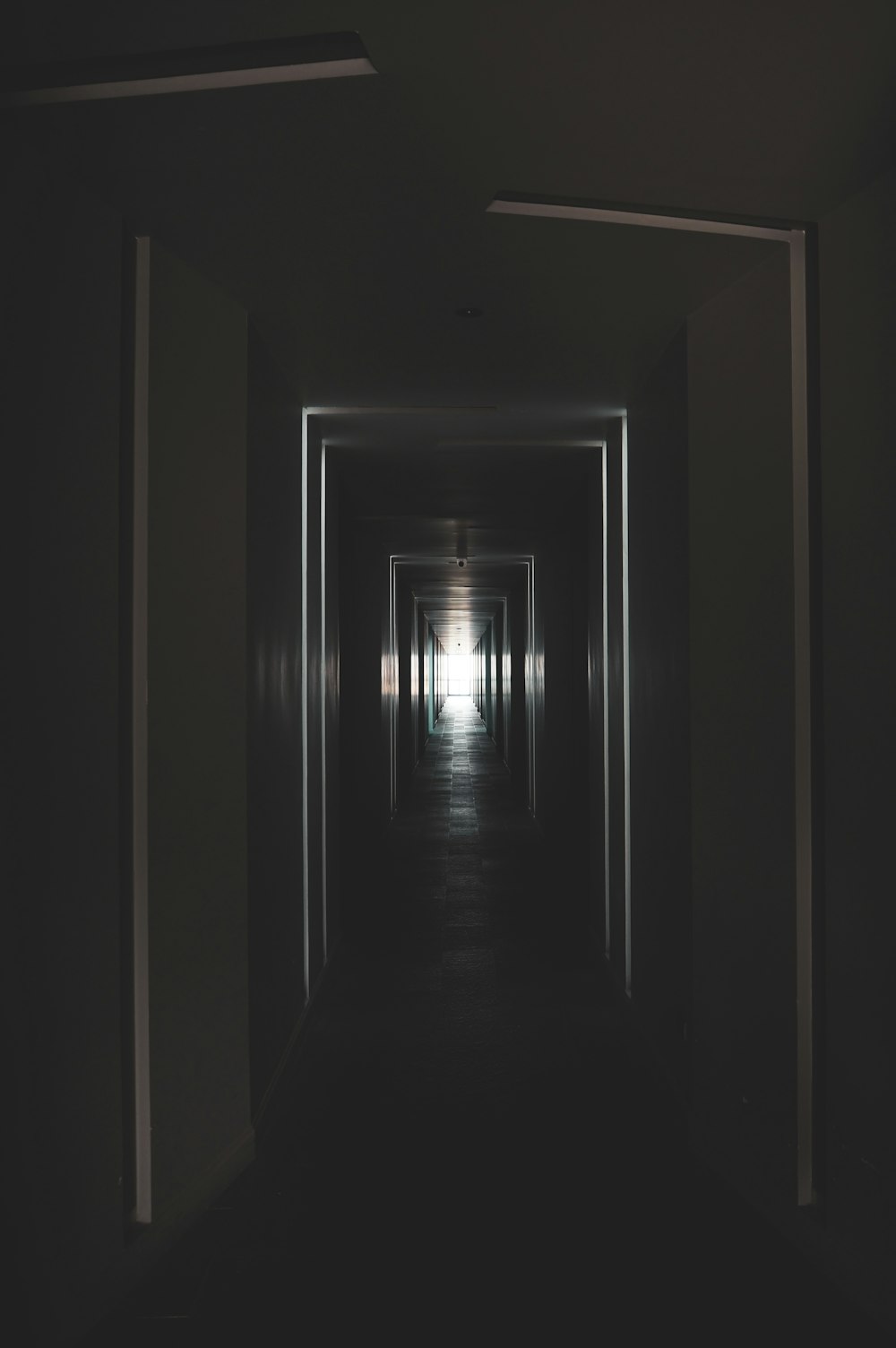 a hallway with a light on