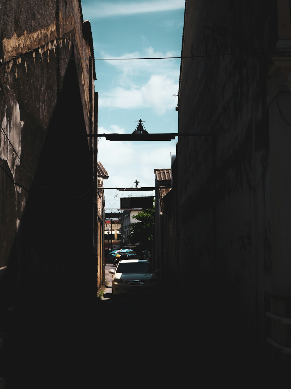 a street with cars and buildings