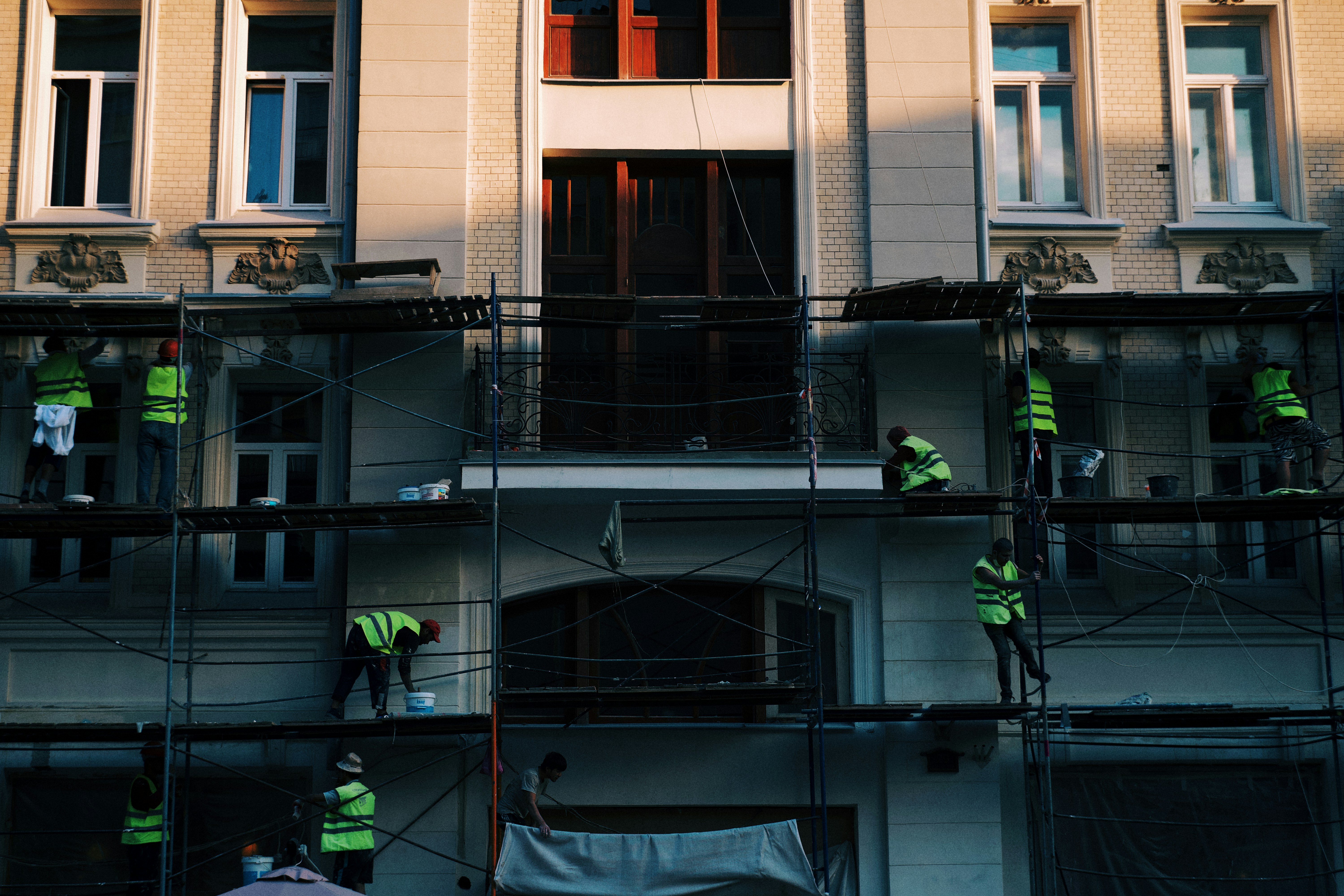 a group of workers on a building