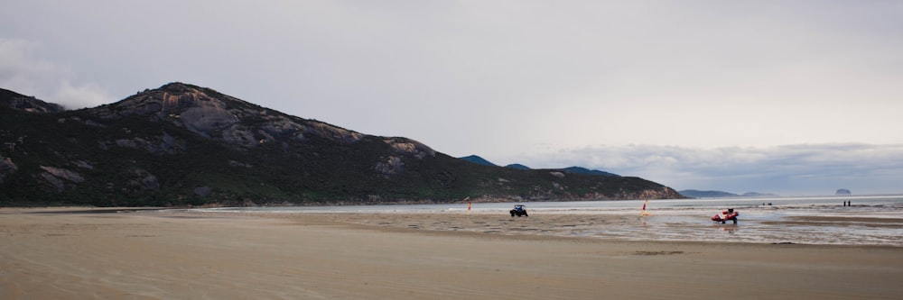 a group of people riding motorcycles on a beach