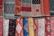 A vibrant collection of handwoven silk sarees on display.
