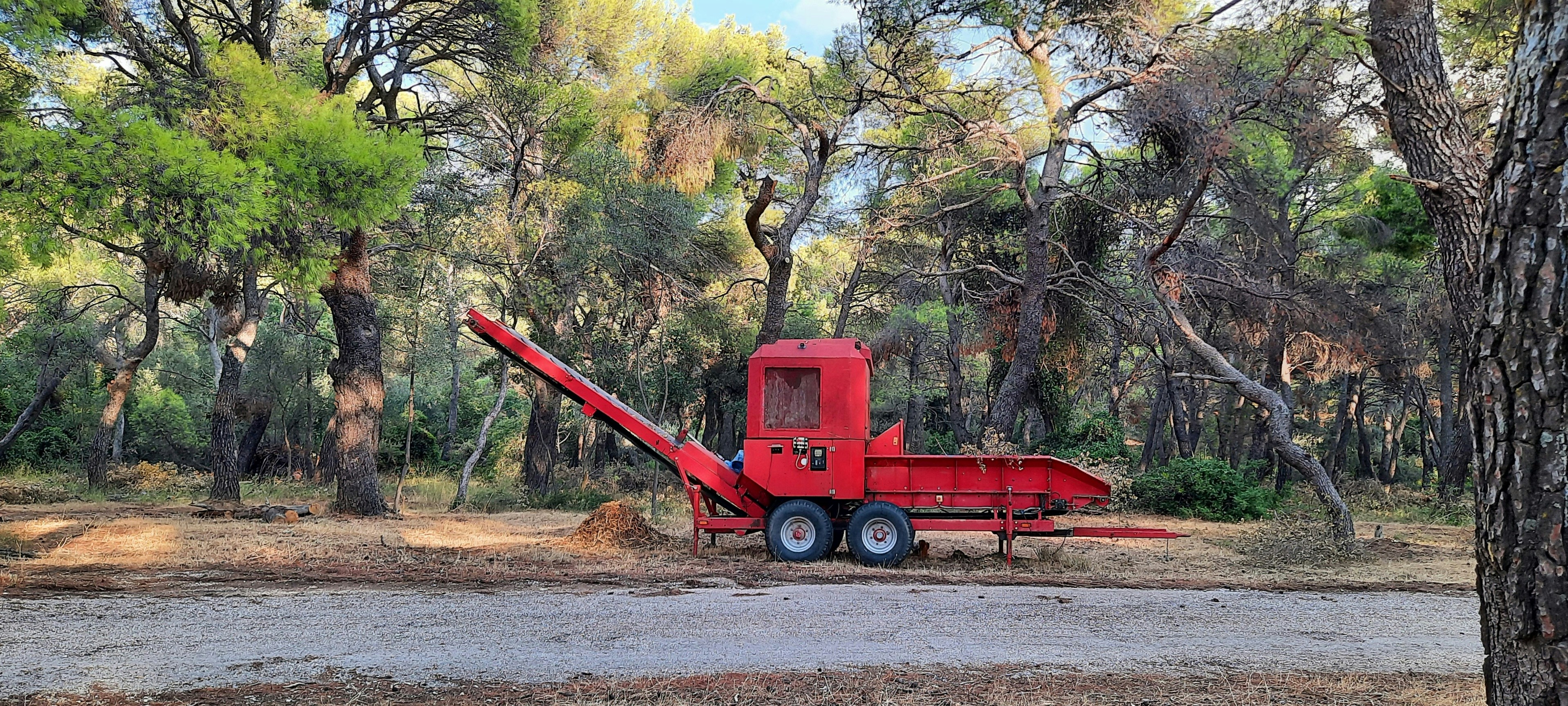 a red tractor on a road