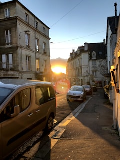 A serene Buenos Aires street at sunset with soft white and light blue tones.