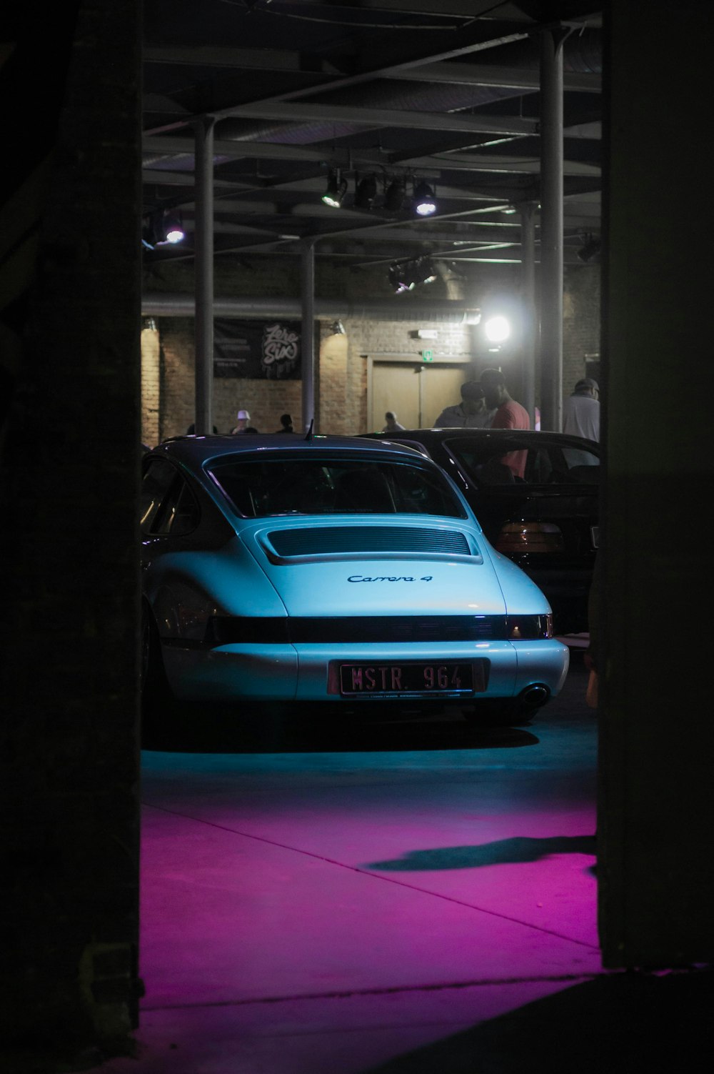 a blue car parked in a garage