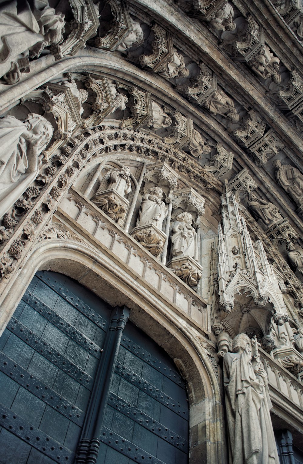 a building with statues on the roof