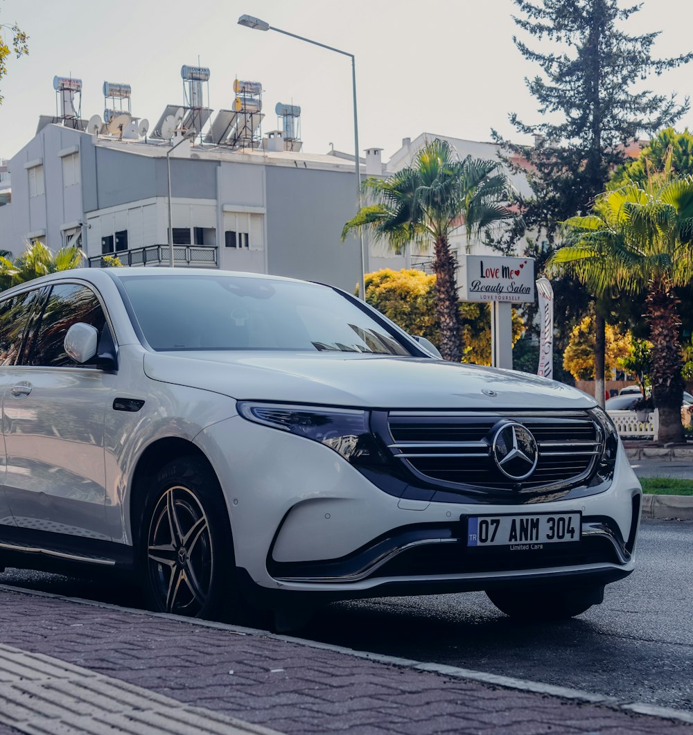 a silver car parked on a street