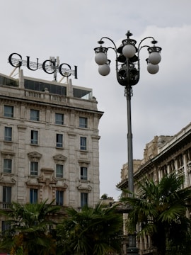 a street light with a building in the background