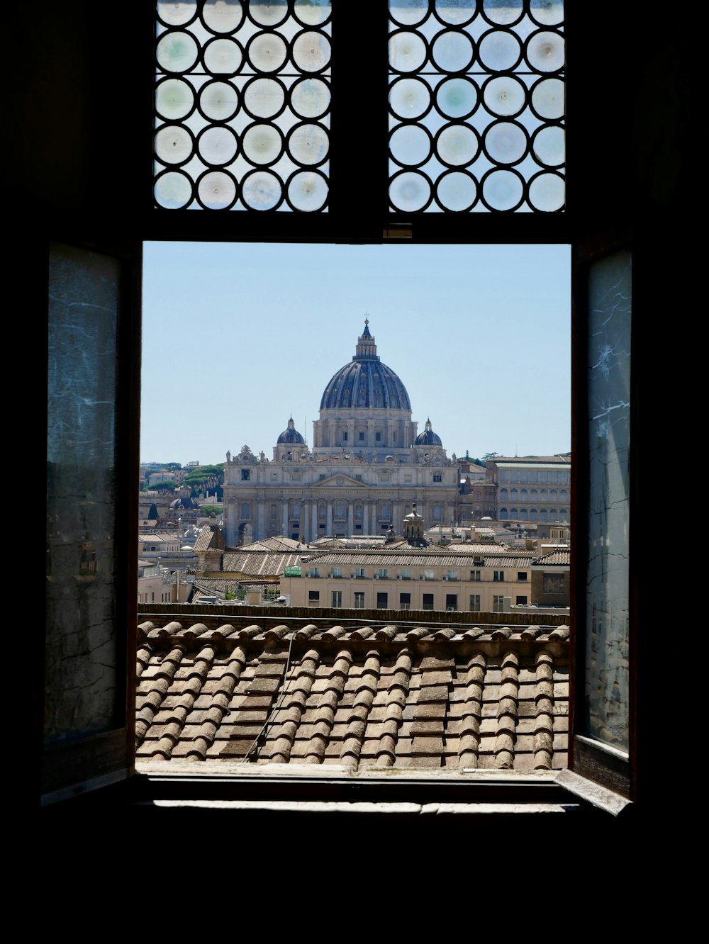 a window with a building in the background