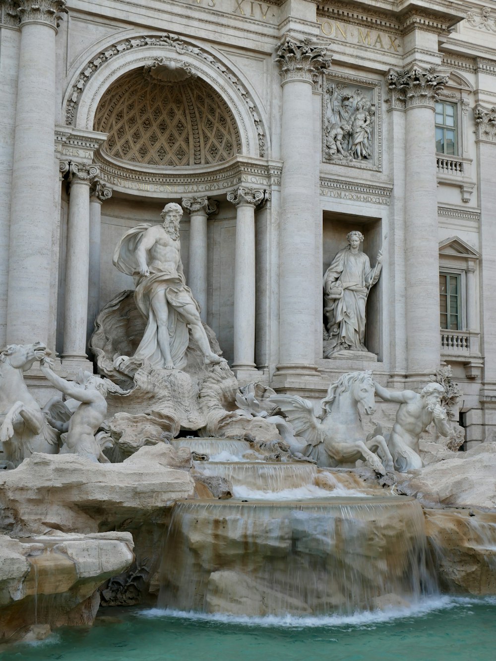 a fountain in front of Trevi Fountain