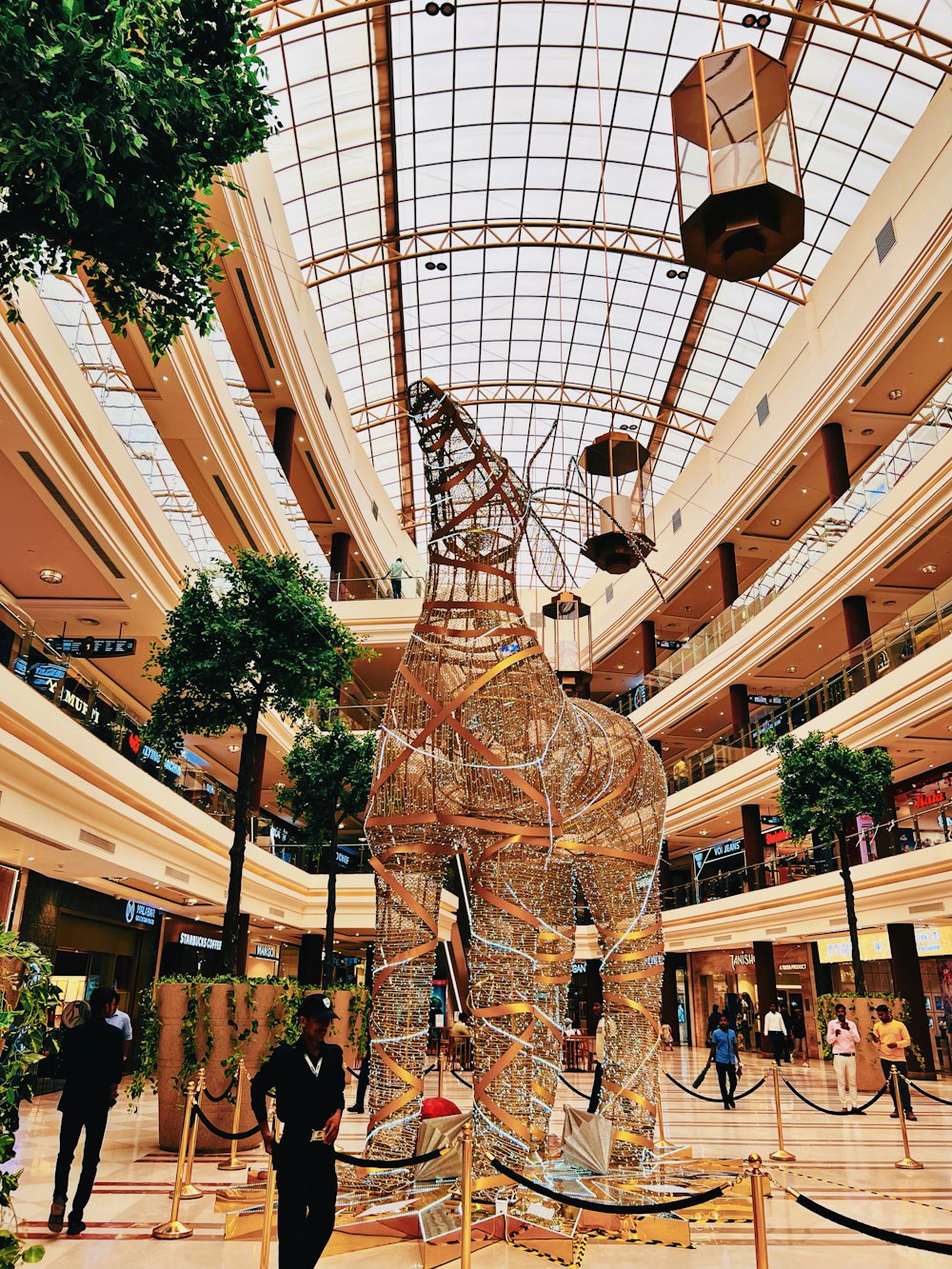 a large building with a large glass ceiling and a large statue of a dragon