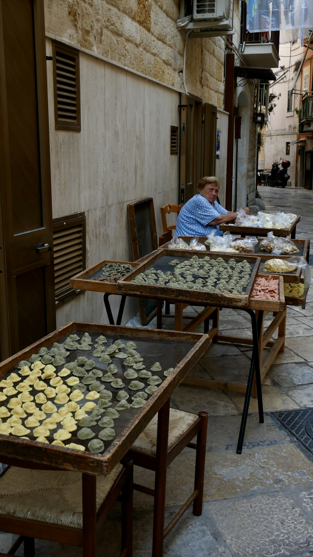 a person sitting at a table with food on it