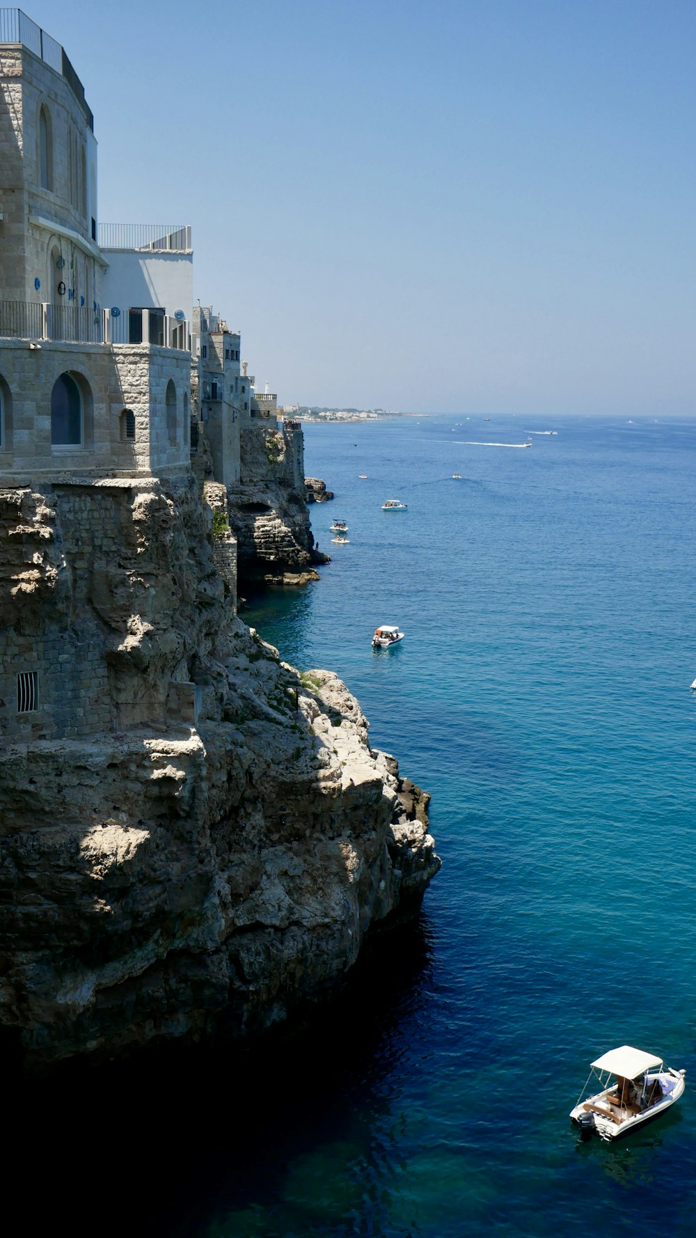 a castle on a cliff over the water