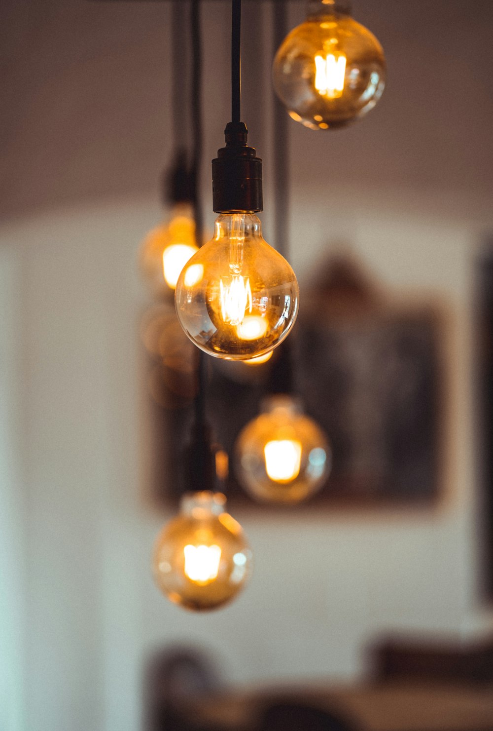 a group of light bulbs from a ceiling