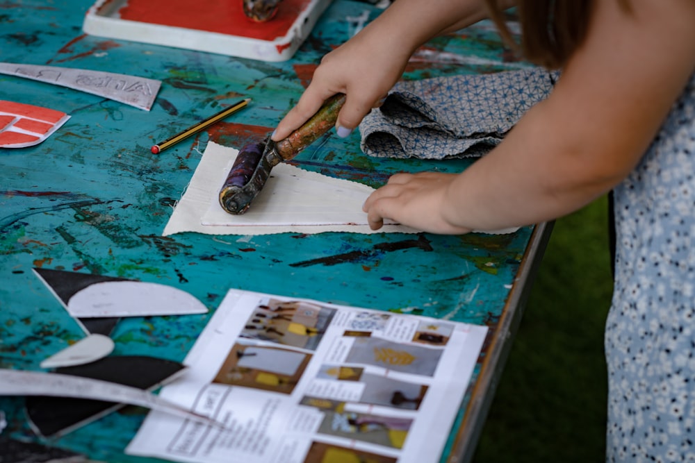 a child painting on a table