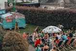a crowd of people sitting on the grass