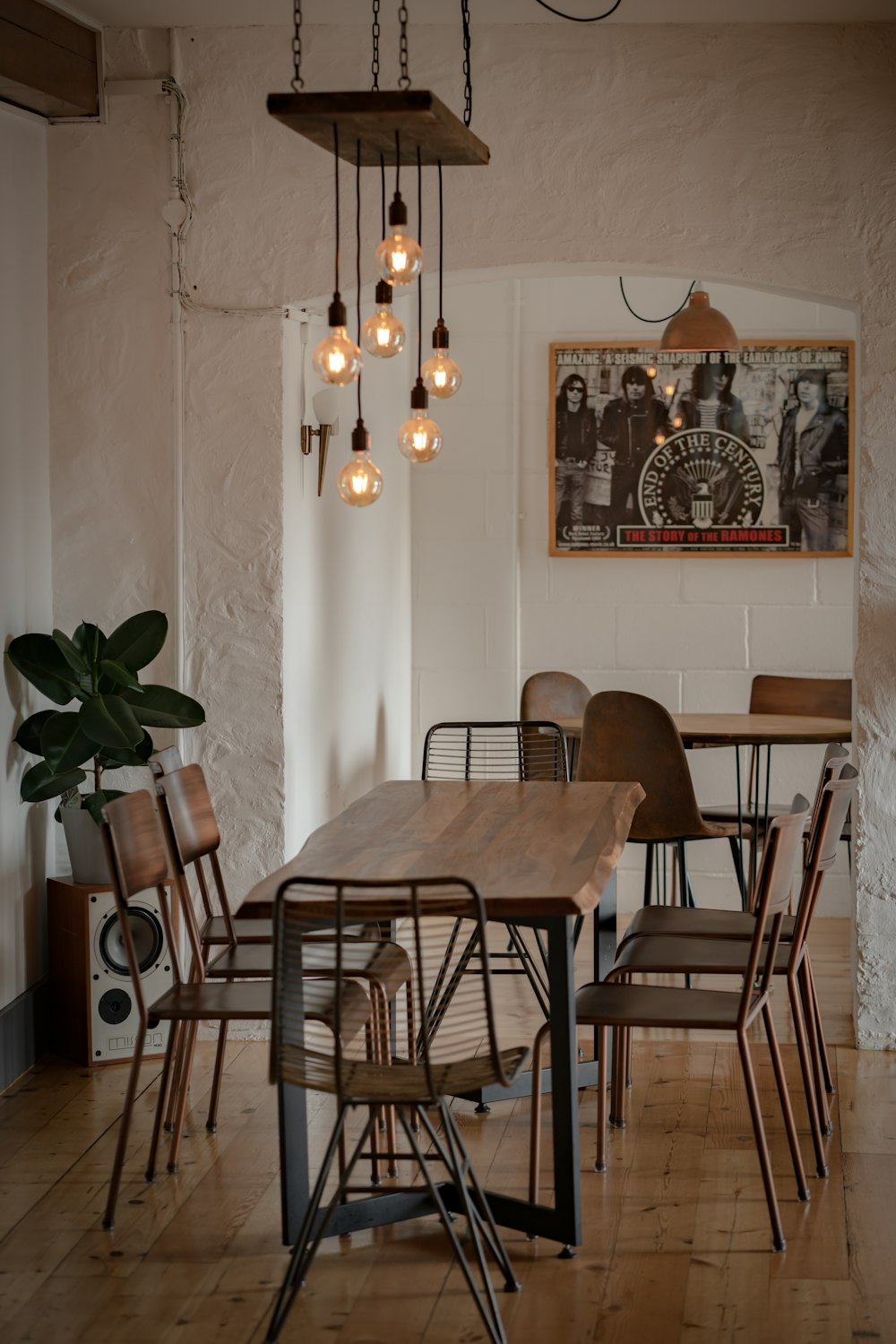 a dining room with a table and chairs