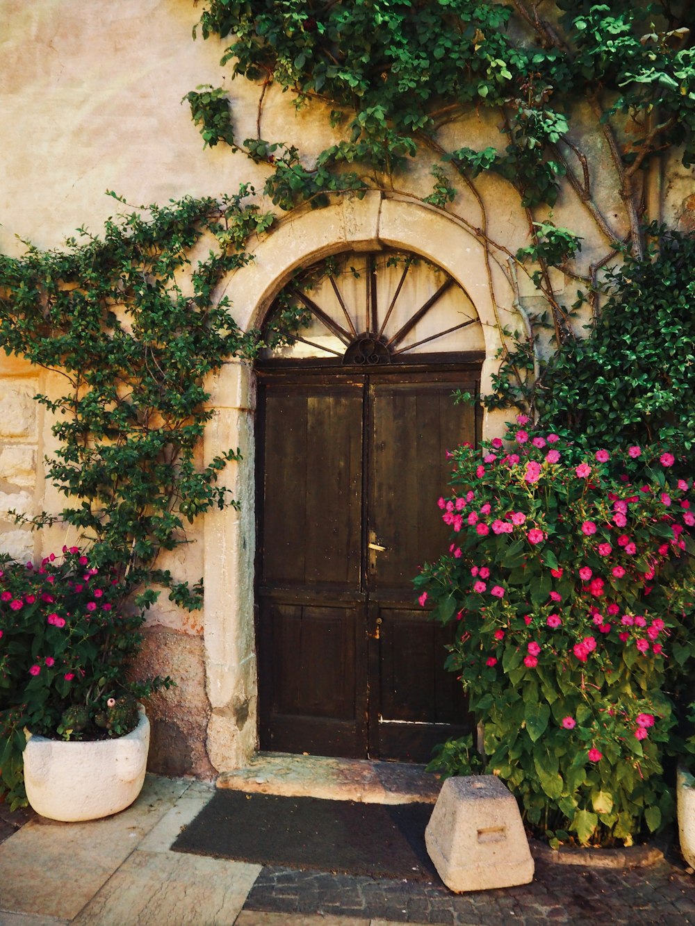 a door with flowers in front of it