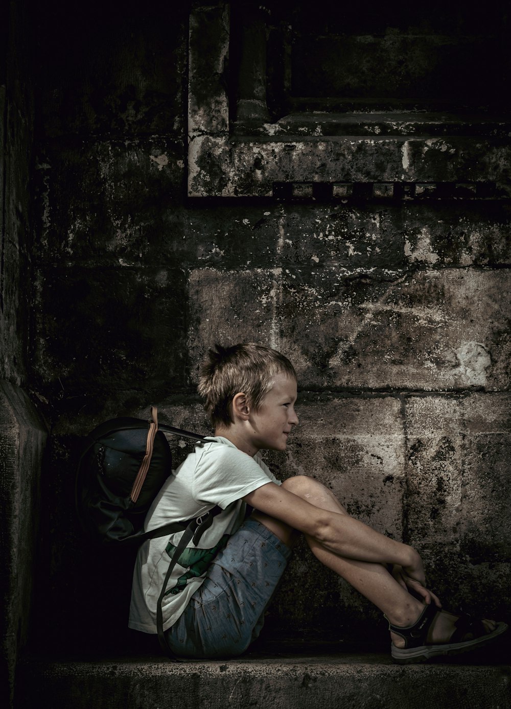 a person sitting on a ledge