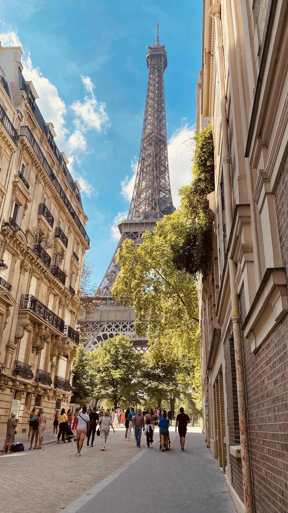 a tall building with a pointy tower in the background