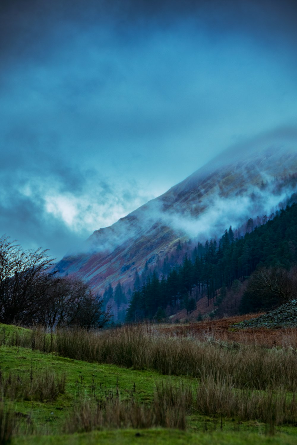 a mountain with clouds