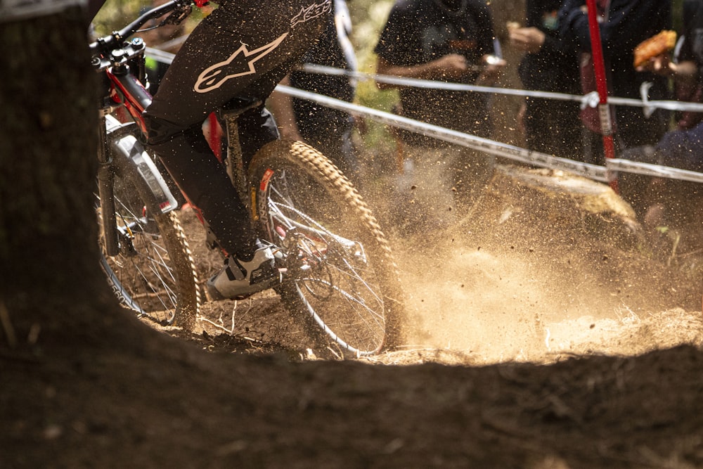 a person riding a bike on a dirt track