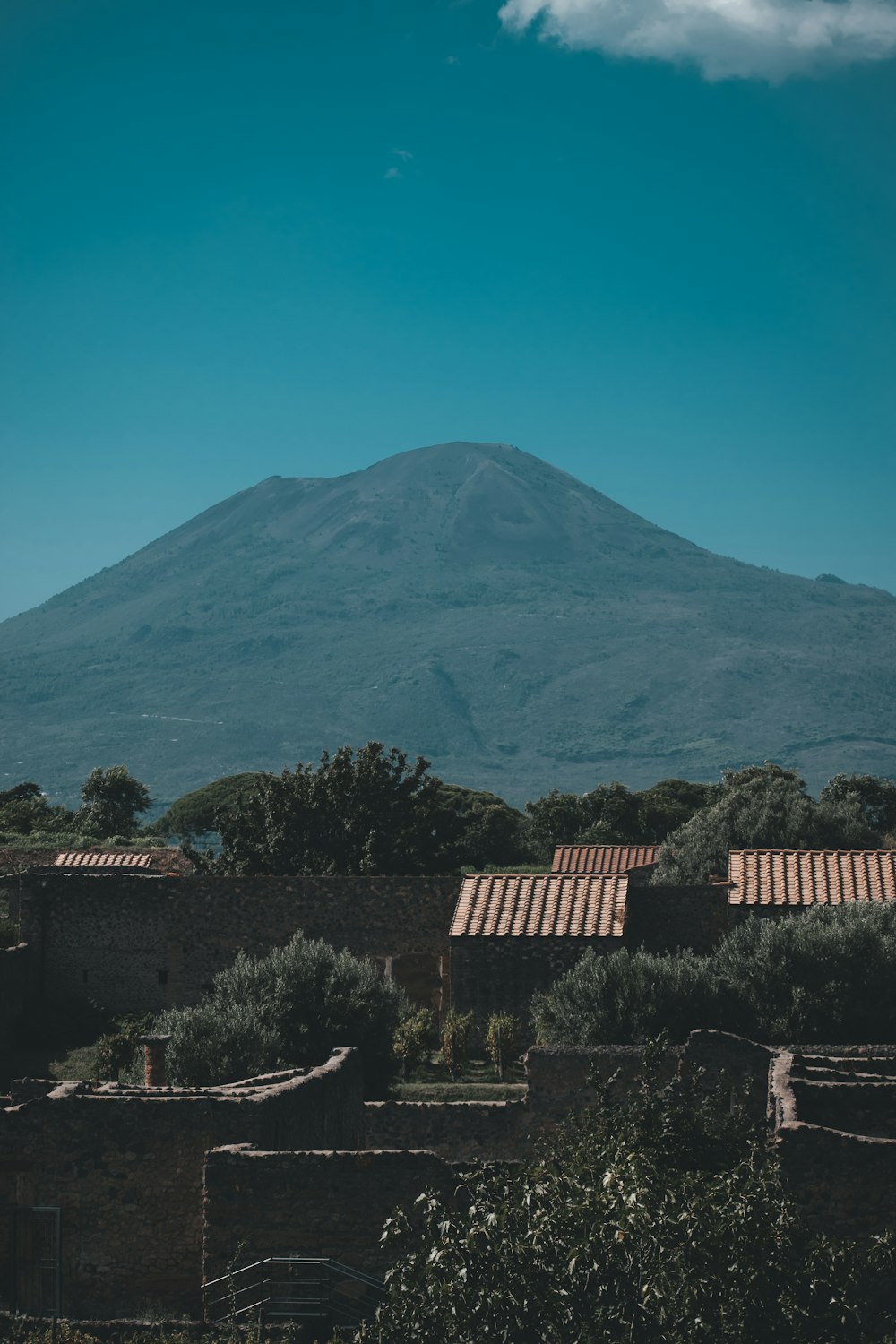 a large mountain behind a town