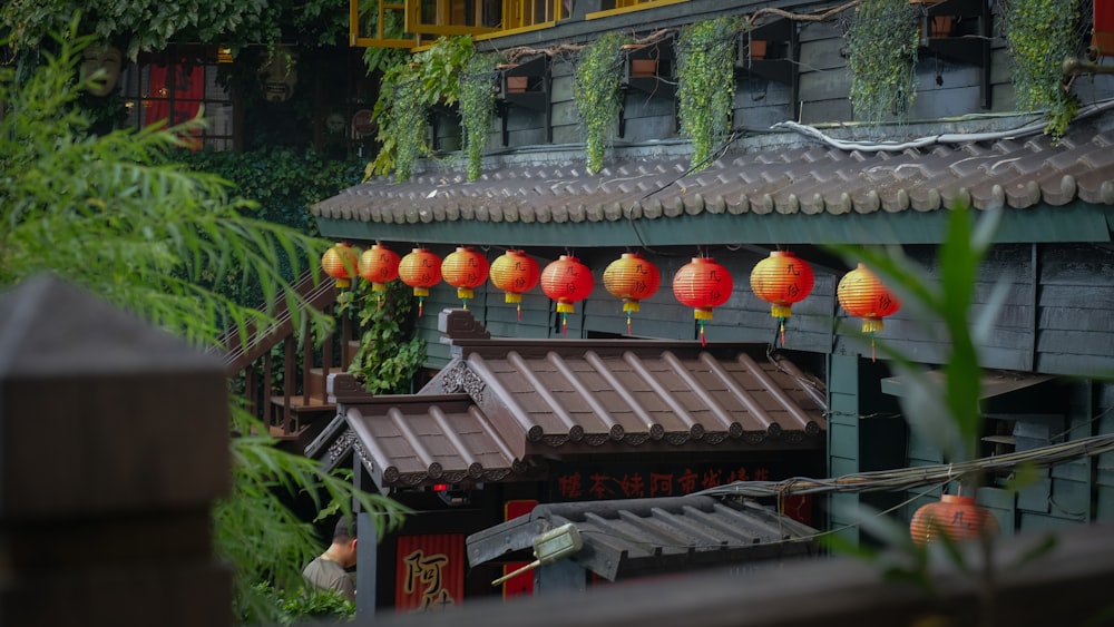 a building with lanterns from it