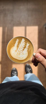 A dynamic lifestyle shoot featuring a person enjoying an urban morning coffee.