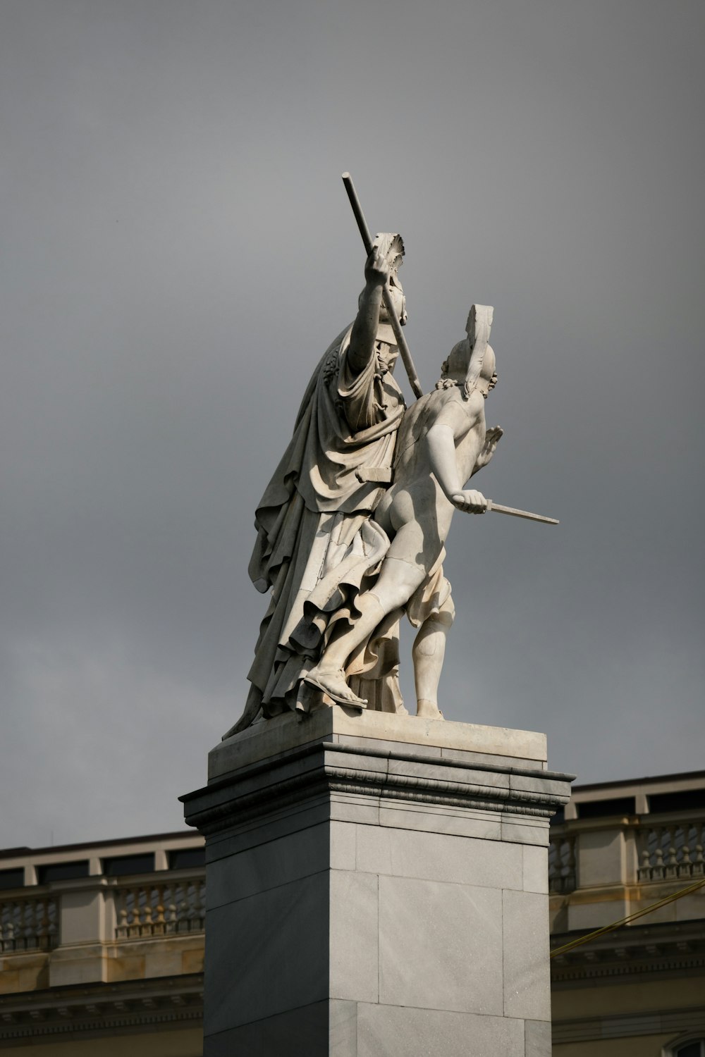 a statue of a person holding a sword