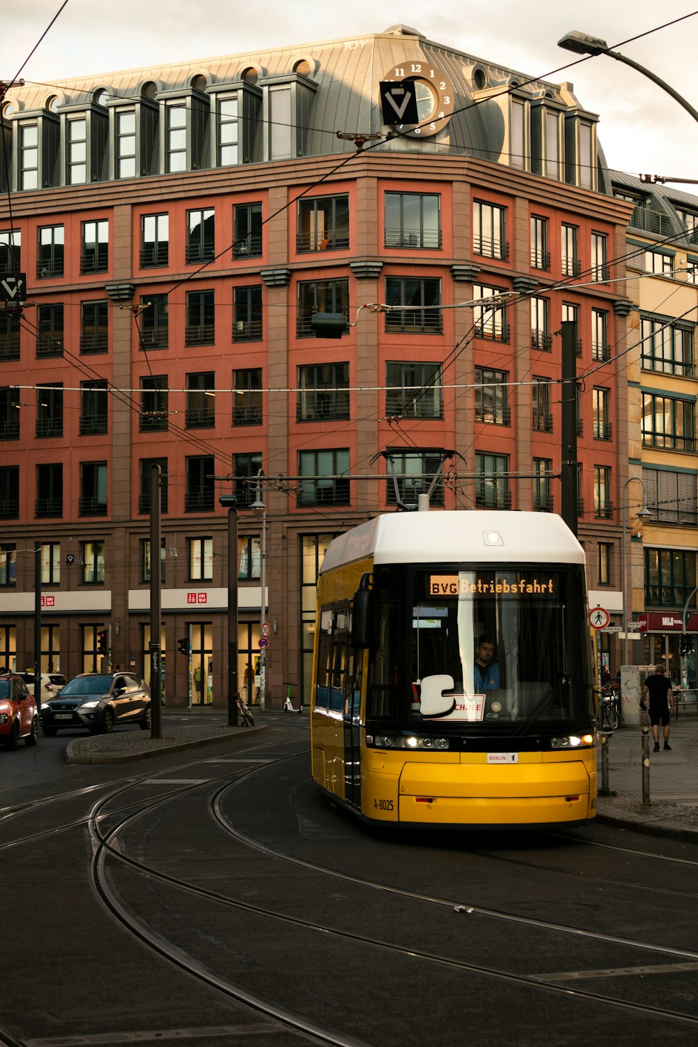 a yellow trolley on a street