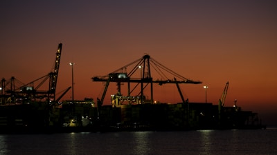 a large crane next to a body of water