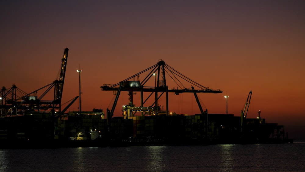 a large crane next to a body of water