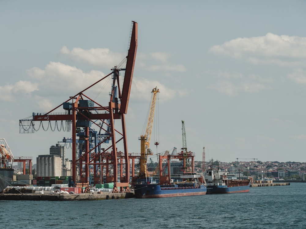 a group of cranes on a dock