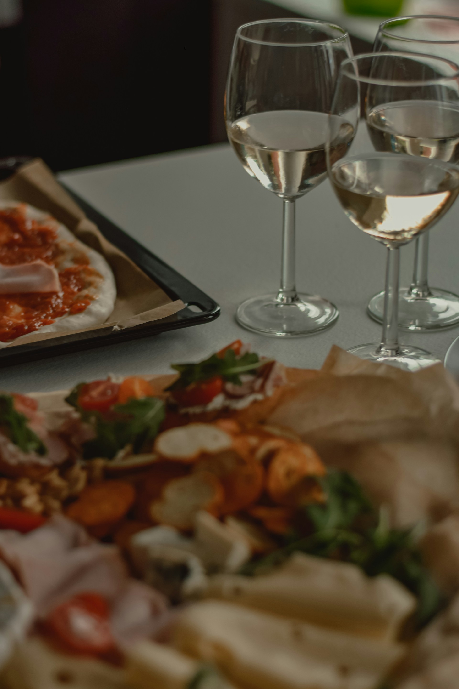 a plate of pizza and wine