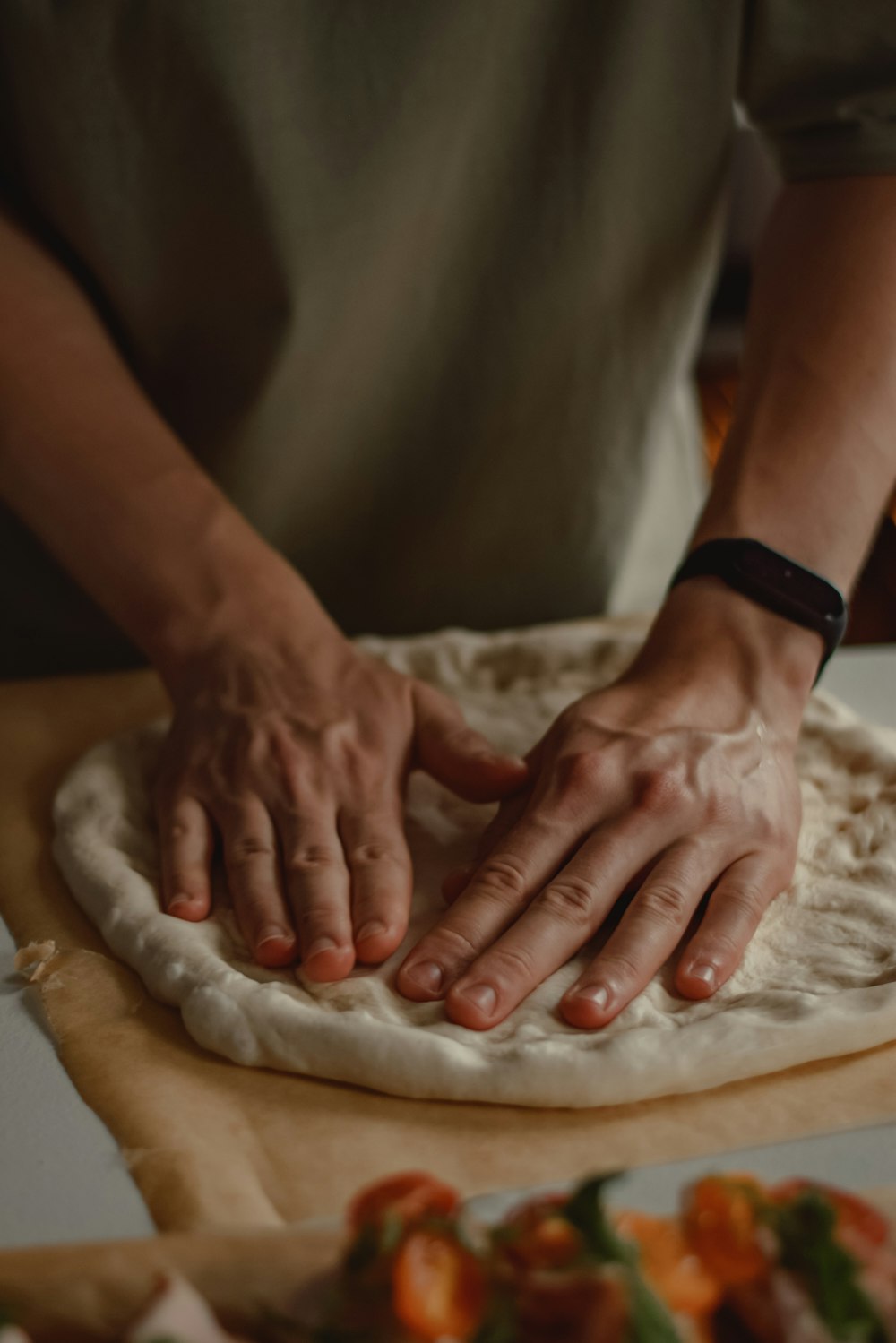 a person's hands on a plate of food