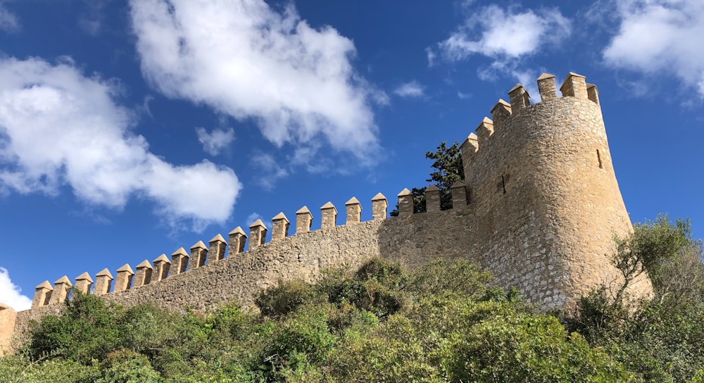 a stone wall with a tower