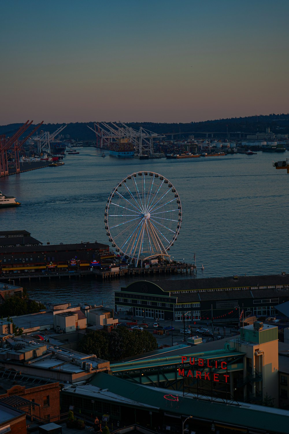 a ferris wheel by a river