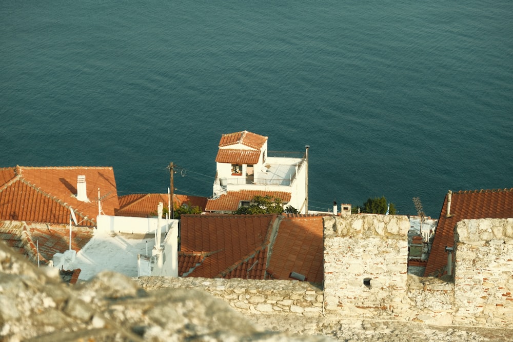 a group of buildings by the water