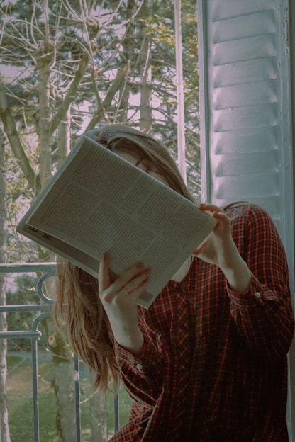 a person holding a newspaper