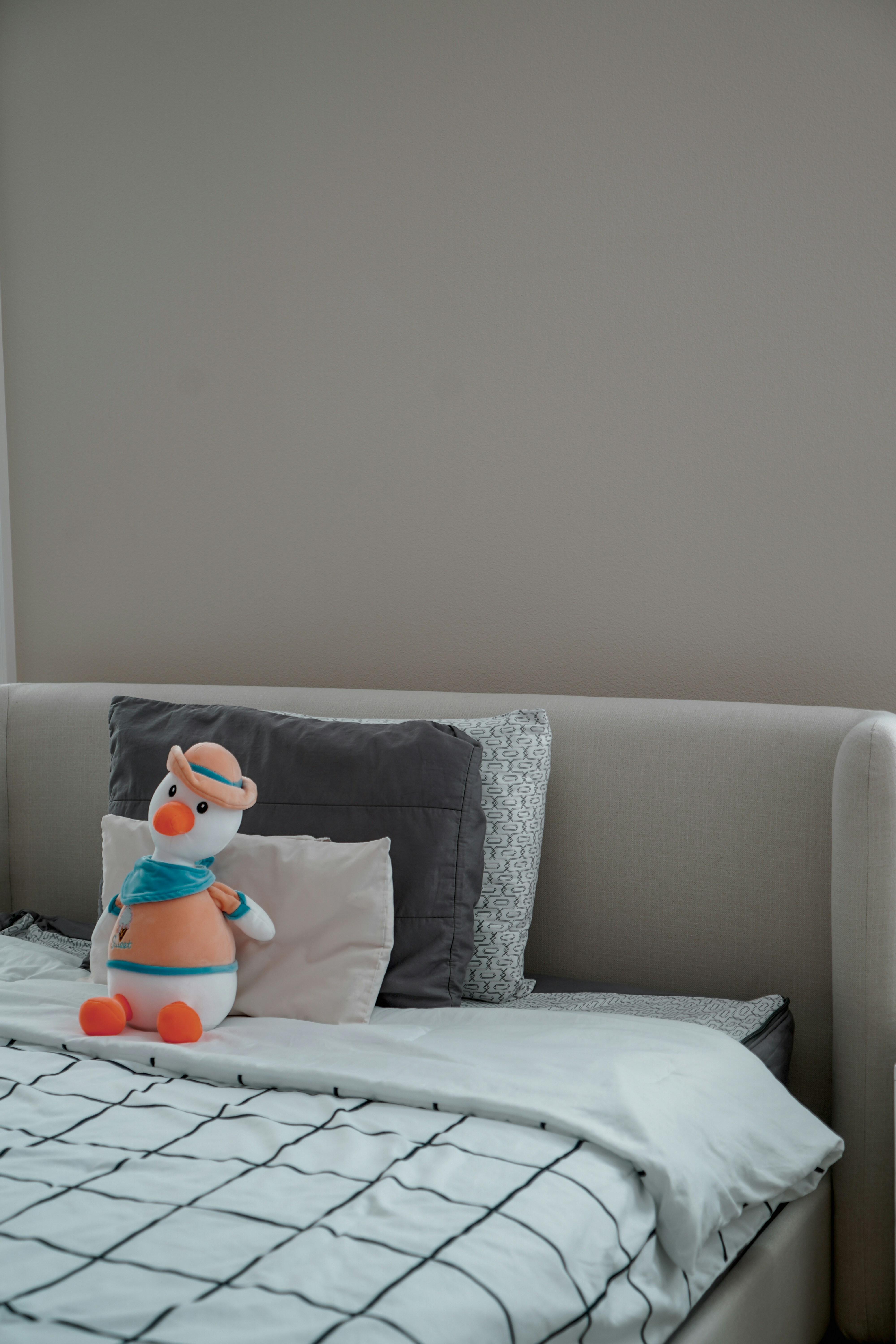 a stuffed toy on a bed