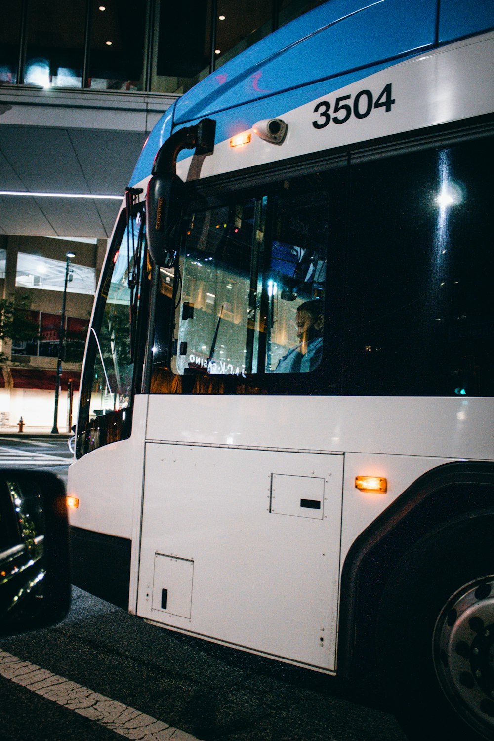 a white bus parked in a parking lot