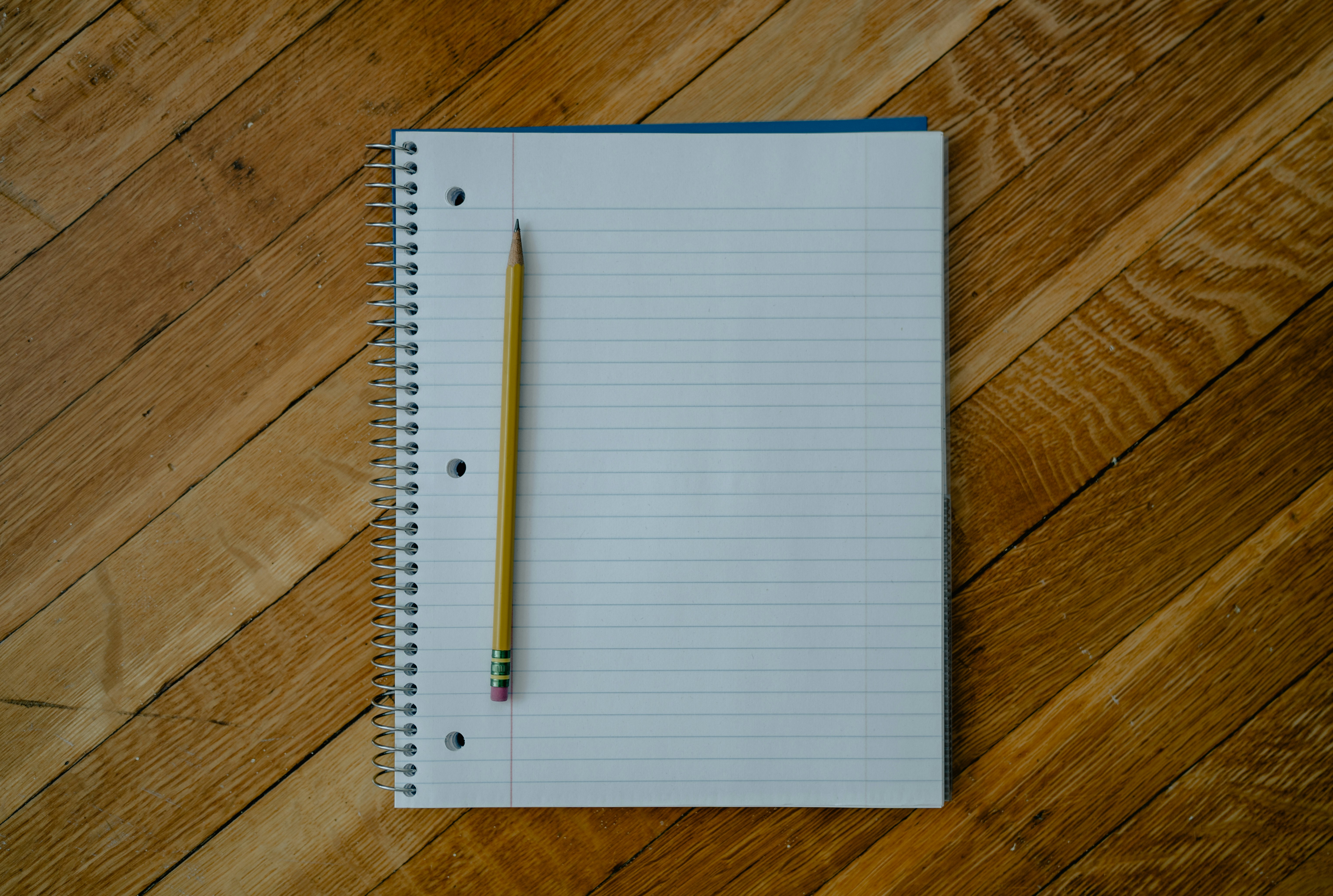 open notebook with a pencil on it