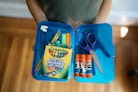 a bag of scissors and a package of scissors on a table
