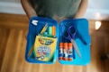 a bag of scissors and a package of scissors on a table