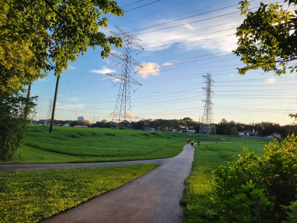 a road with grass and trees on the side