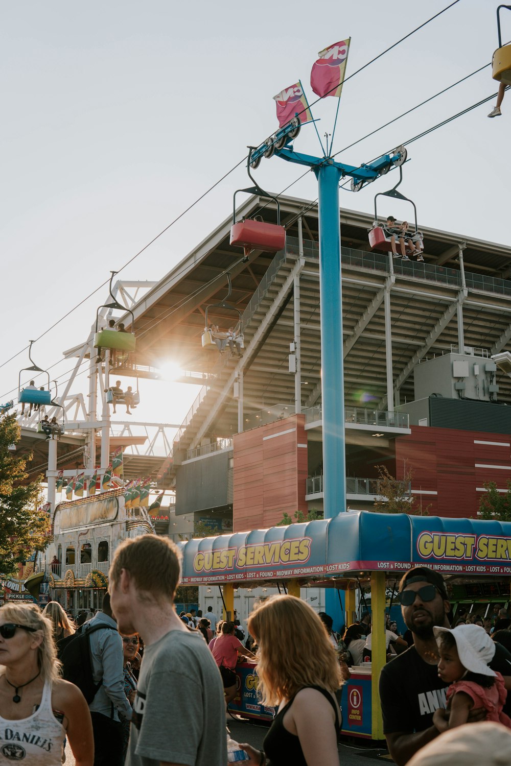 a crowd of people at a theme park