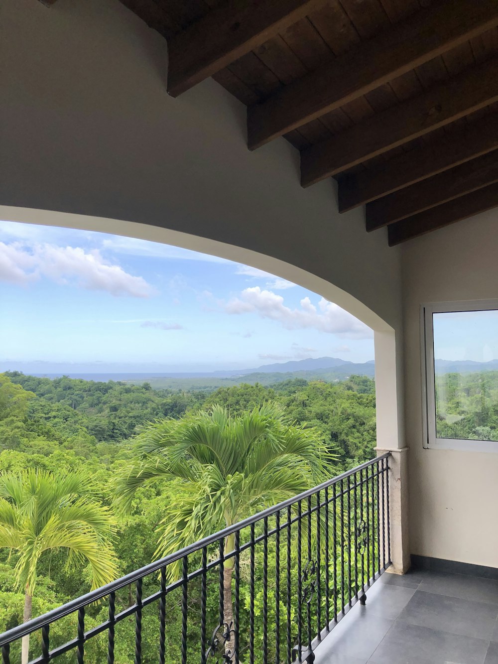 a balcony overlooking a forest